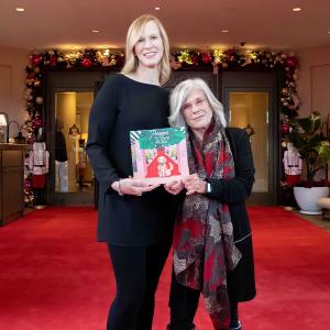 Susan McCauley and Andrea Eastman with 'Trooper' Book