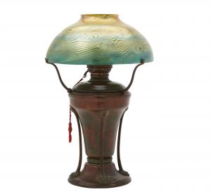 Tiffany Studios patinated bronze glass oil lamp, New York, circa 1900-1902 (est. $2,000-$3,000).