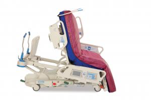 Hill Rom P7500 Progressa bed showing an egress position to help a person get on their feet and out of bed.