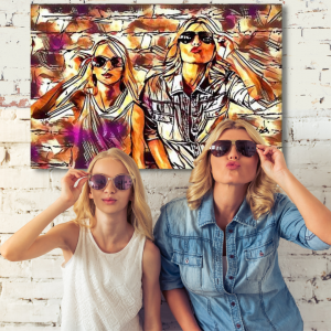 Mother and daugther in sunglasses in front of a brick wall with art of themselves on the wall
